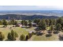 Expansive property with multiple homes, surrounded by lush greenery and breathtaking mountain views at 25392 Westridge Rd, Golden, CO 80403