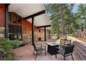 Inviting outdoor patio area with stylish seating, perfect for entertaining or relaxing at 25392 Westridge Rd, Golden, CO 80403