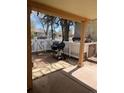 Outdoor patio area with a grill, fenced in for privacy and quaint landscaping at 325 N 7Th Ave, Brighton, CO 80601