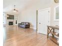Bright living room features hardwood floors, vaulted ceilings and a cozy fireplace at 19249 E Progress Ave, Centennial, CO 80015
