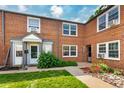Attractive brick multi-Gathering unit with tidy landscaping and a welcoming entrance at 2856 Jasmine St, Denver, CO 80207