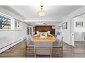 Open floor plan with hardwood floors, leading to kitchen and living area at 5432 E Bails Dr, Denver, CO 80222