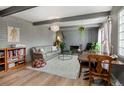 Inviting living room showcasing a gray brick wall, decorative accents, and a comfortable seating area at 9605 E Kansas Cir # 55, Denver, CO 80247