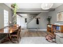 Comfortable living room showcasing wood floors, a table, and neutral decor for a welcoming ambiance at 9605 E Kansas Cir # 55, Denver, CO 80247