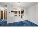 Cozy dining room with a chandelier and easy access to the kitchen at 13890 E Marina Dr # 304, Aurora, CO 80014