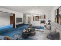 Inviting living room with stylish furniture and an open view to the kitchen at 13890 E Marina Dr # 304, Aurora, CO 80014