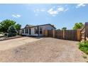 Well-maintained one-story home with a spacious driveway and fenced yard at 657 Locust Ave, Lochbuie, CO 80603