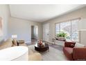Cozy living room with bright natural light and comfortable seating arrangement at 2317 Elmira St, Aurora, CO 80010