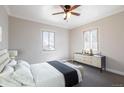 Comfortable bedroom with modern dresser, soft carpet, and bright natural light at 2317 Elmira St, Aurora, CO 80010
