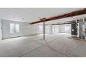Unfinished basement with concrete floors, exposed beams, and wrapped walls, ready for customization at 1667 Fox Trotter Pt, Castle Rock, CO 80104