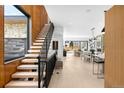 Open-concept living space with wood staircase, hardwood floors and great natural light at 2170 Vine Ave, Boulder, CO 80304