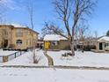 House exterior in snowy neighborhood setting at 2643 S Cook St, Denver, CO 80210