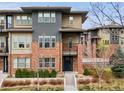 Stylish modern townhome featuring brick facade and large windows at 188 S Locust St, Denver, CO 80224