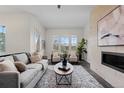 Bright and airy living room with a fireplace, comfortable seating, and natural light at 188 S Locust St, Denver, CO 80224