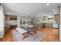 Bright, open kitchen and dining area featuring modern appliances and hardwood floors at 6769 E Costilla Cir, Centennial, CO 80112