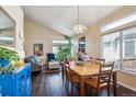 Open floor plan integrates living and dining areas, with vaulted ceilings and natural light at 1281 S Allison St, Lakewood, CO 80232