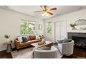 Inviting living room featuring hardwood floors, a fireplace and lots of natural light at 3116 Black Canyon Way, Castle Rock, CO 80109