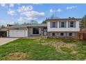 Charming two-story home with a well-maintained front yard and attached two-car garage in a residential neighborhood at 16533 E Baker Pl, Aurora, CO 80013