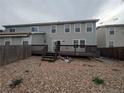 A spacious backyard area with a wooden deck perfect for outdoor entertaining and relaxation at 9322 Jackson St, Thornton, CO 80229