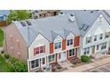 Attractive two-story townhome with colorful facade, decorated gable, and well-kept roof at 6776 S Independence St, Littleton, CO 80128