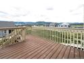 Spacious wooden deck with scenic mountain views, perfect for relaxing and entertaining outdoors at 16858 Greyhawk Dr, Monument, CO 80132