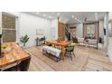 Open-concept living area features a spacious dining room, living room, and staircase at 2318 Arapahoe St, Denver, CO 80205