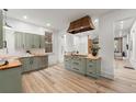 Spacious kitchen featuring custom cabinets, butcher block countertops and modern stainless steel appliances at 2318 Arapahoe St, Denver, CO 80205
