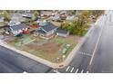 This aerial view showcases a charming home with a spacious yard on a corner lot in a quiet neighborhood at 400 Division Blvd, Platteville, CO 80651