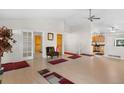 Bright and airy living room with vaulted ceilings and an open layout, leading to the kitchen at 977 S Salida St, Aurora, CO 80017