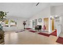 Spacious living room with vaulted ceilings, a fireplace, and lots of natural light from large windows at 977 S Salida St, Aurora, CO 80017