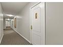 Long hallway featuring neutral colors and carpet leading to different rooms at 800 N Washington St # 307, Denver, CO 80203