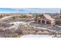 Attached garage and tennis court with mountain views at 1175 Ridge Oaks Dr, Castle Rock, CO 80104