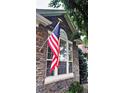 Close-up of stone elevation with a window showing natural light at 12164 Adams St, Thornton, CO 80241