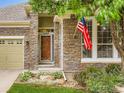 Close up of the stone elevation and front entry of this charming home at 12164 Adams St, Thornton, CO 80241