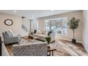 Bright living room featuring large windows and comfortable seating at 6914 E Briarwood Dr, Centennial, CO 80112