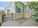 Close-up of the home's exterior highlighting architectural details and entryway with a gate at 10231 Spotted Owl Ave, Highlands Ranch, CO 80129