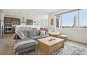 Open-concept living area with kitchen, dining area, and comfortable seating at 545 High Point Dr, Longmont, CO 80504