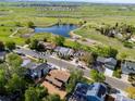 An aerial shot shows a home near Josh's Pond/Trails at 3238 W 11Th Avenue Pl, Broomfield, CO 80020