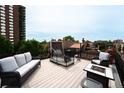 Rooftop deck with comfortable seating and city views at 1165 N Pennsylvania St # 3B, Denver, CO 80203