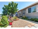 Lovely single-story home featuring a manicured front yard and an inviting entrance and walkway at 6120 W 111Th Ave, Westminster, CO 80020