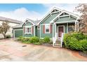 Craftsman style home with tidy landscaping, red shutters, covered porch, and a 2-car garage at 13263 Niwot Trl, Broomfield, CO 80020