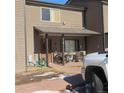 Charming covered front porch with cozy seating area provides a welcoming entrance to this lovely townhome at 473 N Banner St # B, Elizabeth, CO 80107