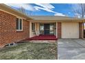 Inviting front porch with a cozy swing, offering a relaxing spot to enjoy the outdoors at 2675 N Saint Paul St, Denver, CO 80205