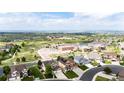 Community aerial view shows houses and school in a Gathering-friendly neighborhood at 22962 Briar Leaf Ave, Parker, CO 80138