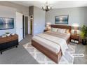 Stylishly staged bedroom with a neutral color scheme and modern furnishings at 1885 S Quebec Way # H27, Denver, CO 80231
