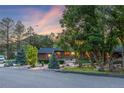 Lovely exterior view of the home with mature trees and professional landscaping at 19 Rock Ln, Castle Rock, CO 80104