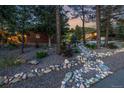 Gravel yard with unique rock and stone design elements surrounding a cozy home at 19 Rock Ln, Castle Rock, CO 80104