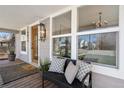Inviting front porch with bench seating, offering a cozy spot to enjoy the outdoors at 5612 Ammons St, Arvada, CO 80002