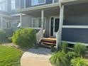 Inviting home featuring a covered porch, well-maintained landscaping, and a cozy entrance at 19246 E Idaho Pl # 102, Aurora, CO 80017