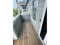 Private balcony featuring gray siding, and wood floors at 19246 E Idaho Pl # 102, Aurora, CO 80017